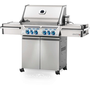 Napoleon Prestige Pro 500 RSIB gas grill with glowing blue control knobs