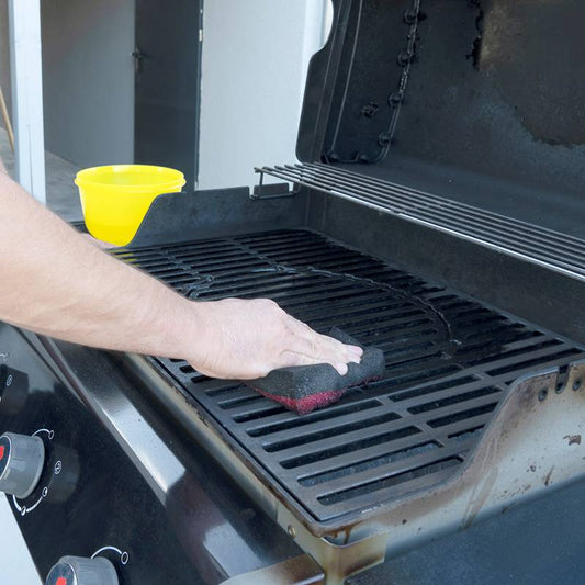 Cleaning the outdoor gas grill.